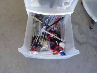 3 Drawer Plastic Storage Cart Full Of Miscellaneous Items In All Drawers