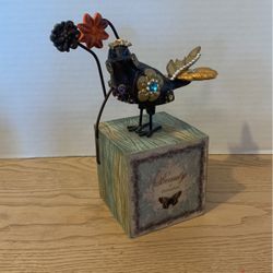 Bird sit outside By Lori Seibert