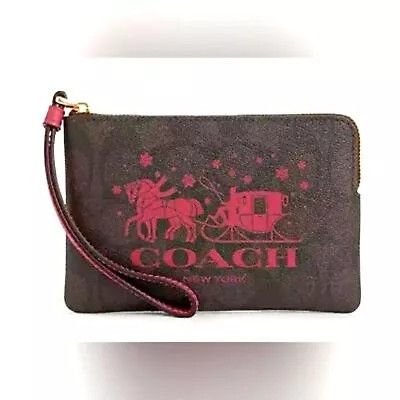 COACH Corner Zip Wristlet In Signature Canvas With Horse And Sleigh