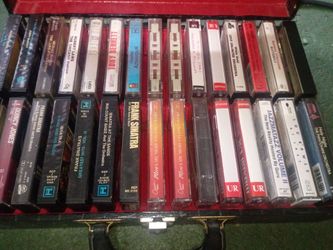30 Cassette tape collection in suitcase
