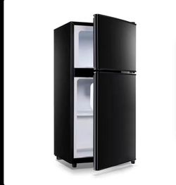 New compact mini fridge with freezer on top