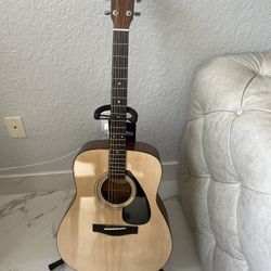 Acoustic Guitar with tuner, chips, stand, and carrying case 