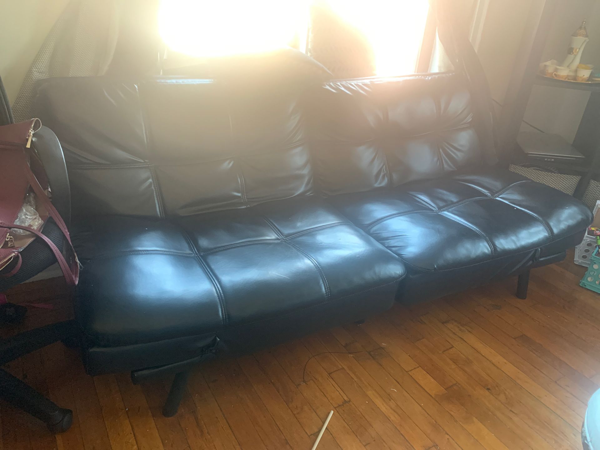 Faux leather futon, converts to bed