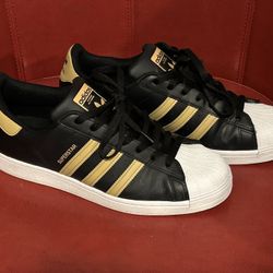 Adidas Black And Gold Superstar (size 12)