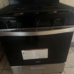 Amana Refrigerator And Whirlpool Stove