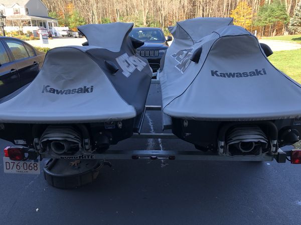 (2) 2017 kawasaki jetskis w/trailer, covers and in water docks