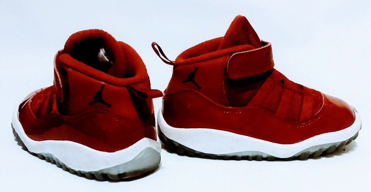 pair of red Air Jordan 11's