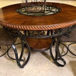Beautiful Ashley Wooden Round Table OBO