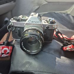 CANON AE1 PROGRAM FILM CAMERA & 28 MM WIDE ANGLE LENS