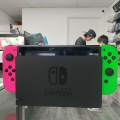 Nintendo Switch With Green And Pink Joycons 