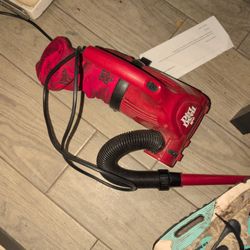 The item in the image is a red Dirt Devil Ultra Handheld Corded Vacuum. 
