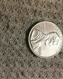 1996 penny missing the thin layer of copper from the mint