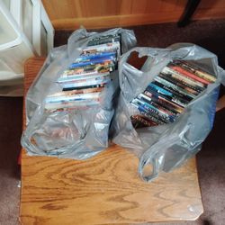 2 Bags Of DVDs Over 20 Titles 
