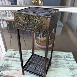 Black metal plant stand