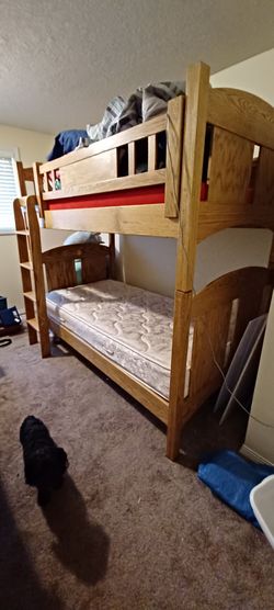 Bunk beds with 1 mattress and Minnie mouse and hello kitty linens