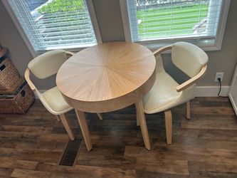 Small auxiliary dining table with two swivel chairs