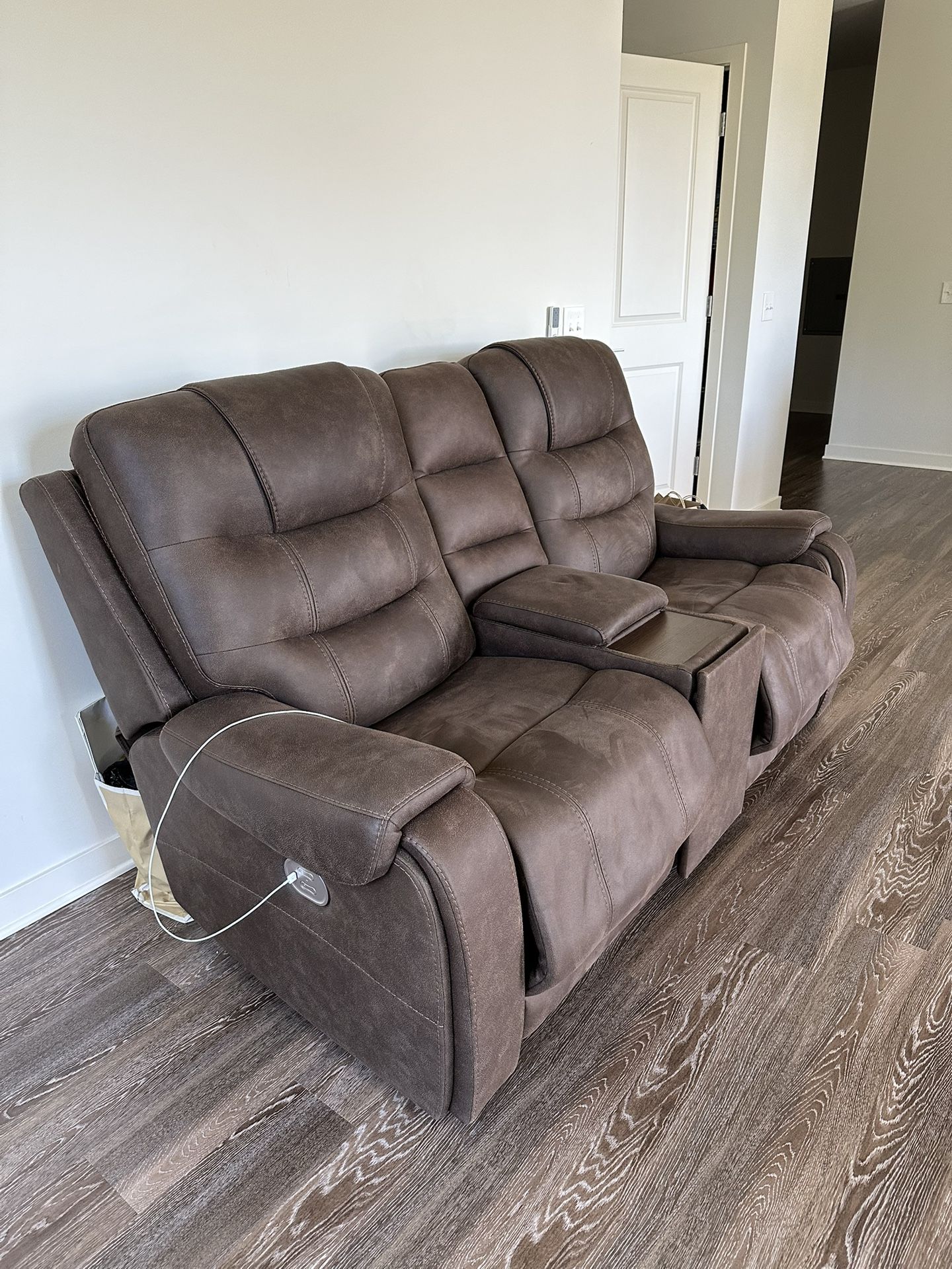 Reclining leather couch with phone charging Stations