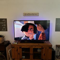 TCL 65” LED TV With Very Nice Real Wood Entertainment Center