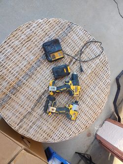 Two Batteries Two Drills And Charger
