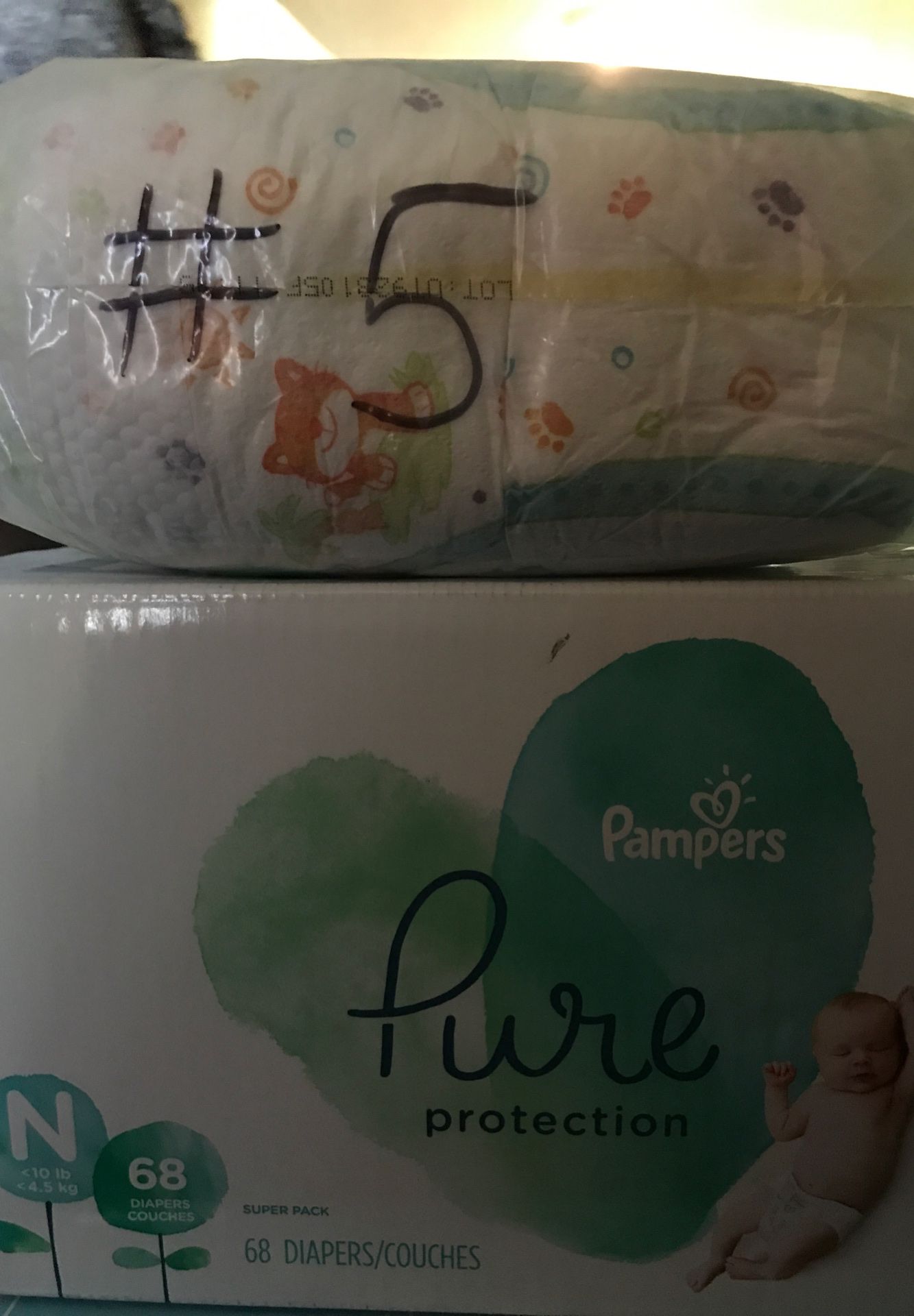 Newborn Pampers and size 5 diapers