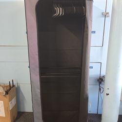 Covered Garment Rack With Hangers
