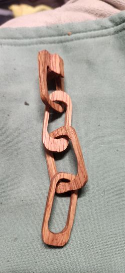 Handcrafted carved wood chain, ball in a cage , and more