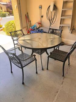 4 heavy chairs with table