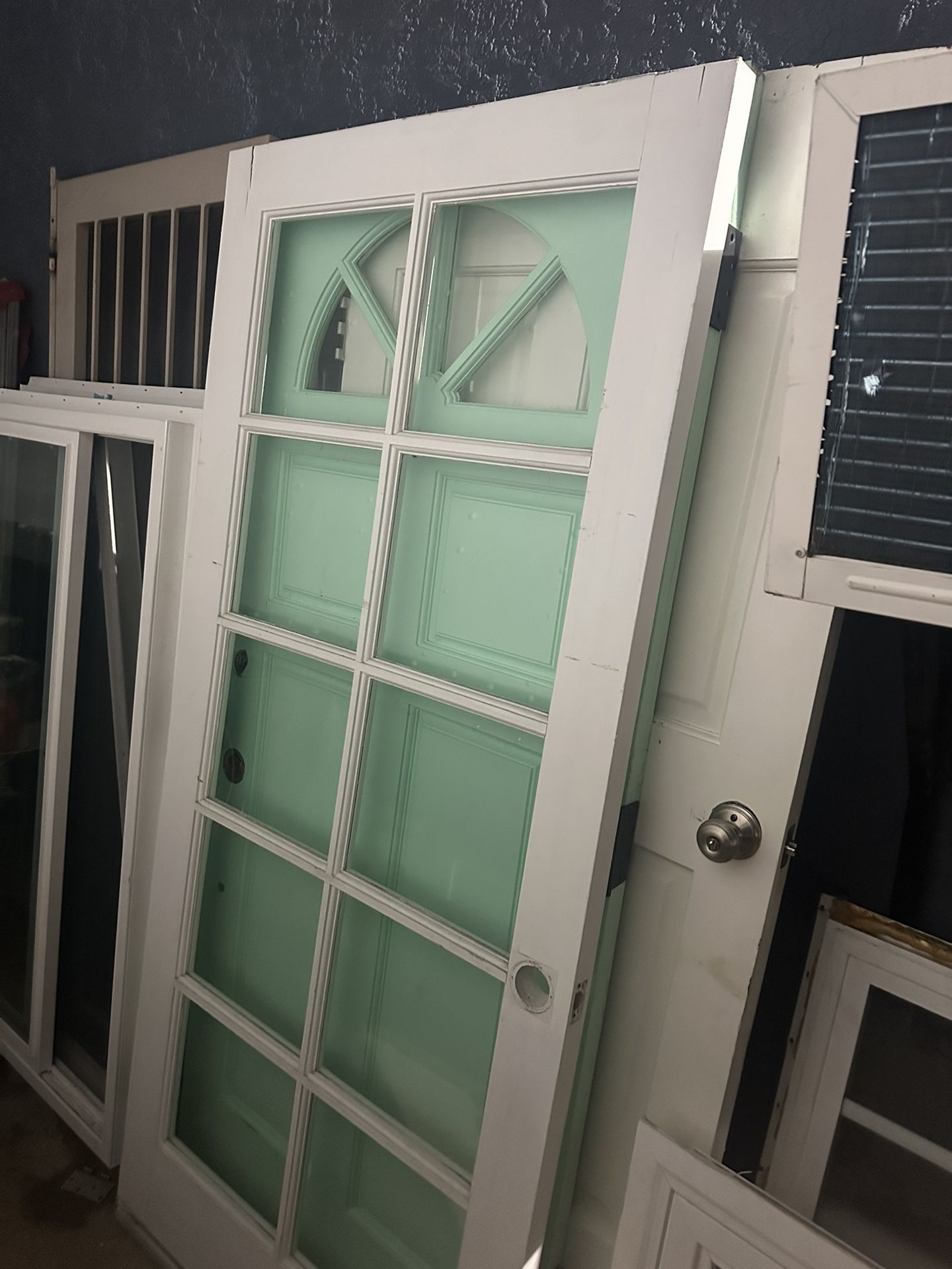 Wooden Front Door with glass design 36 inches wide 80 inches height Door has two cracks on the top right corners does not affect the door just thr