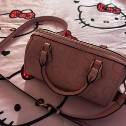 Pink adjustable Guess Purse 