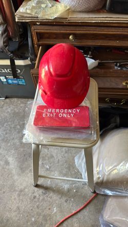 Hard hat and ten emergency exit signs