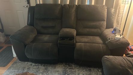 Ashley furniture reclining loveseat with center console