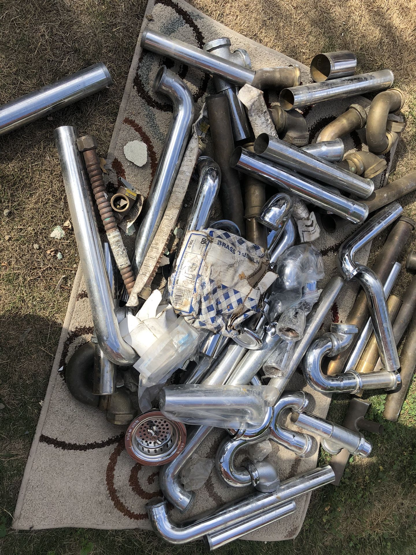 All brass traps and strainers, shower heads and water heater connectors
