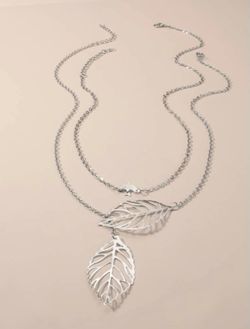 Gorgeous 2 piece hanging leaf and bird necklaces