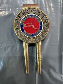 The Golf Club at Chapel Ridge, NC. Vintage golf divot repair tool featuring a built-in magnetic ball marker and a built-in money/belt clip on the back