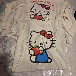 Adorable Hello Kitty size S tshirt featuring a charming design with red and blue 