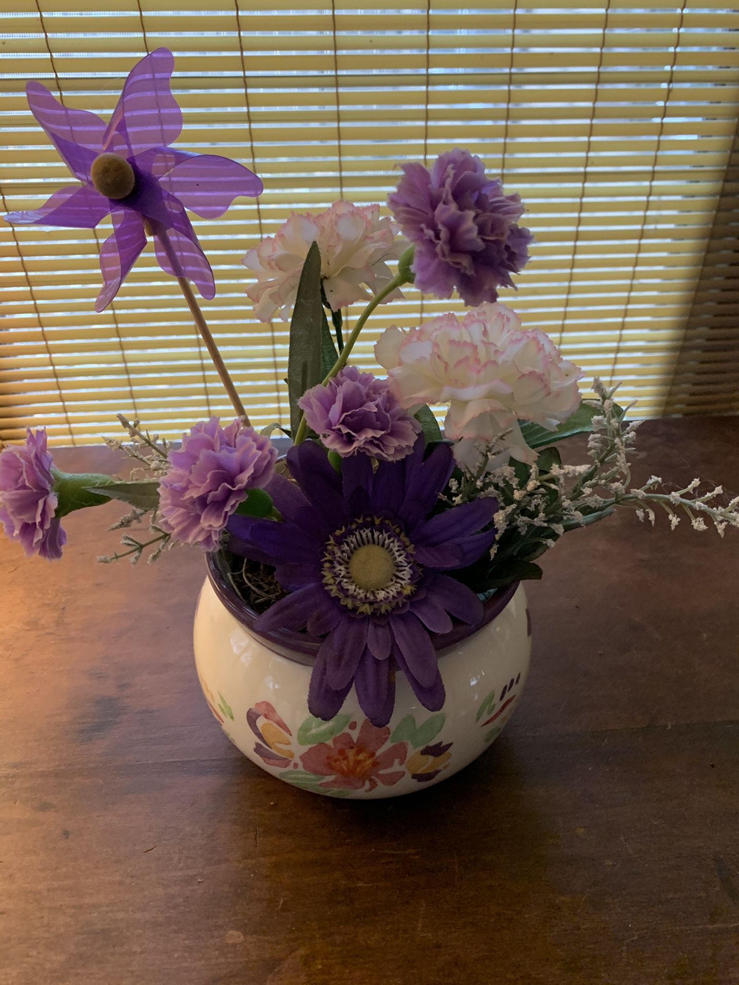 Ceramic vase with artificial flowers