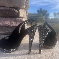 Giuseppe Zanotti black 5 ” heel shoe women size 7 1/2” fair condition. There are a few stones missing.  Black suede 