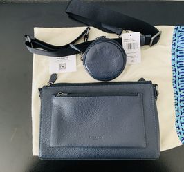 Coach Holden Crossbody Bag in the color Midnight Blue (Style No. CE682). It is a 2-in-1 set that includes a pebbled leather crossbody pouch and a deta