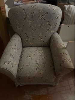 Blue floral cushioned rocking chair
