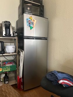Refrigerator, toaster oven, microwave.