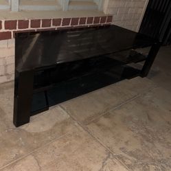 entertainment center with glass shelves