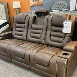 The Man-Den Gray Power Reclining Sofa And Recliner
$10 Down Payment And Financing Available
Ashley Furniture