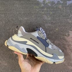 Balenciaga Triple S Sneakers in a Grey, White, and Blue colorway