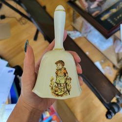 vintage porcelain gold trimmed bell boy picking flowers import from japan