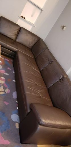 Left hand facing brown genuine leather sectional. Available for pick up only.