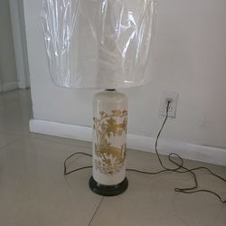 Asian-style lamp in cream and gold.