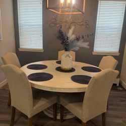 Beautiful solid wood dining room table with 5 chairs included.