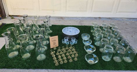 Wood slices, carafe glasses, Mason jars, table number holders