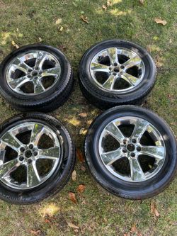 Size 235/55R18 10 W set of four tires/rims like new