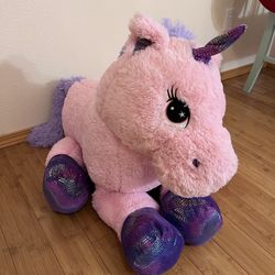 Giant pink and purple stuffed unicorn plush